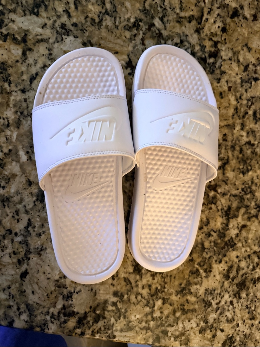 Nike White Slide Sandals with Embossed Swoosh